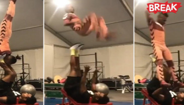 Astounding moment acrobat flips his partner through air with just his feet